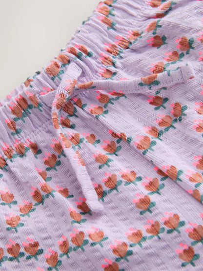 |Girl| Calças Largas Texturizadas Com Estampa Floral Miúda Roxa (3 meses a 7 anos)