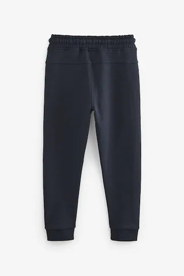|Chico Grande| Joggers Tech Sportswear - Azul marino (3-17 años)
