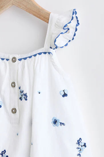 |BabyGirl| Macacão Tecido Para Bebê – Bordado Floral Branco/Azul (0 meses a 2 anos)